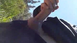Stroking my big horny uncut wet cock at the beach
