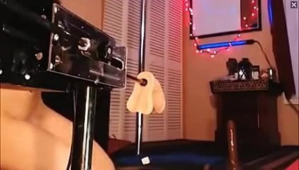 Latex girl uses vibrator while she gets fucked by a sex machine