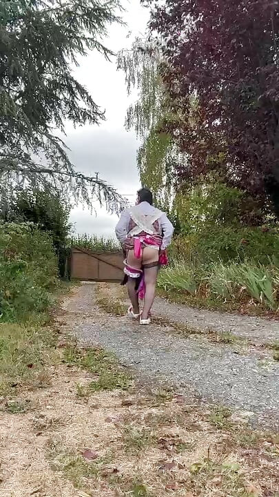 In a gardener outfit with a pink dress for a day