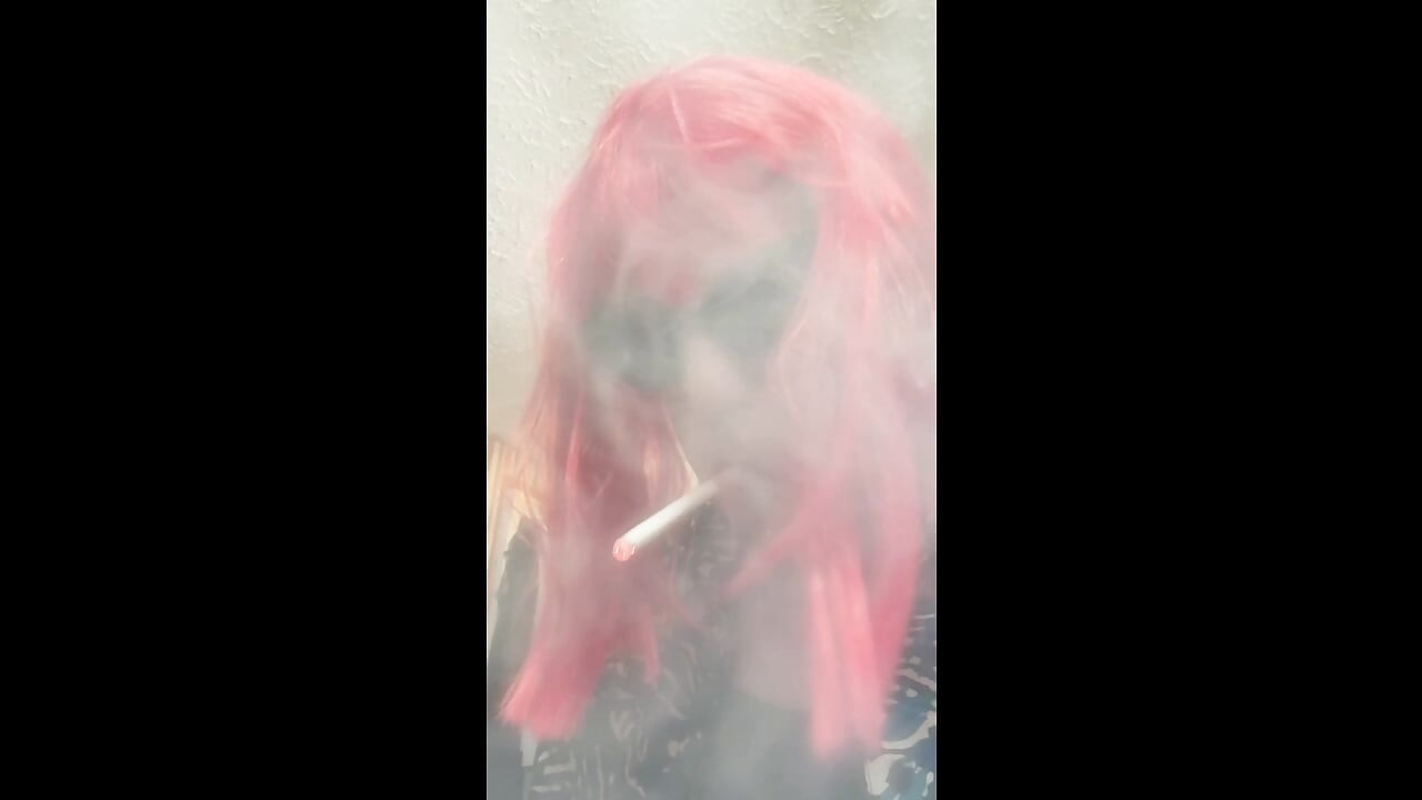 MRS. ROMAN DESTROYING A MARLBORO 100 MENTHOL CLOSE UP - WITH DANGLING AND NOSTRIL EXHALES