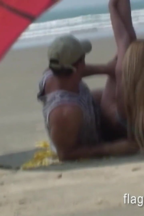 Brazilian couple having sex on the empty beach