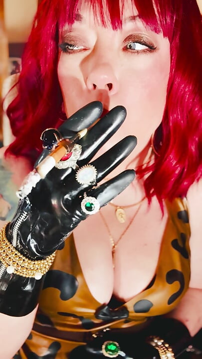 The Beautiful Rubber Beauty Tina Snua Smoking A Cigarette Using A Holder - Smoker Latex Gloves Rings Jewellery