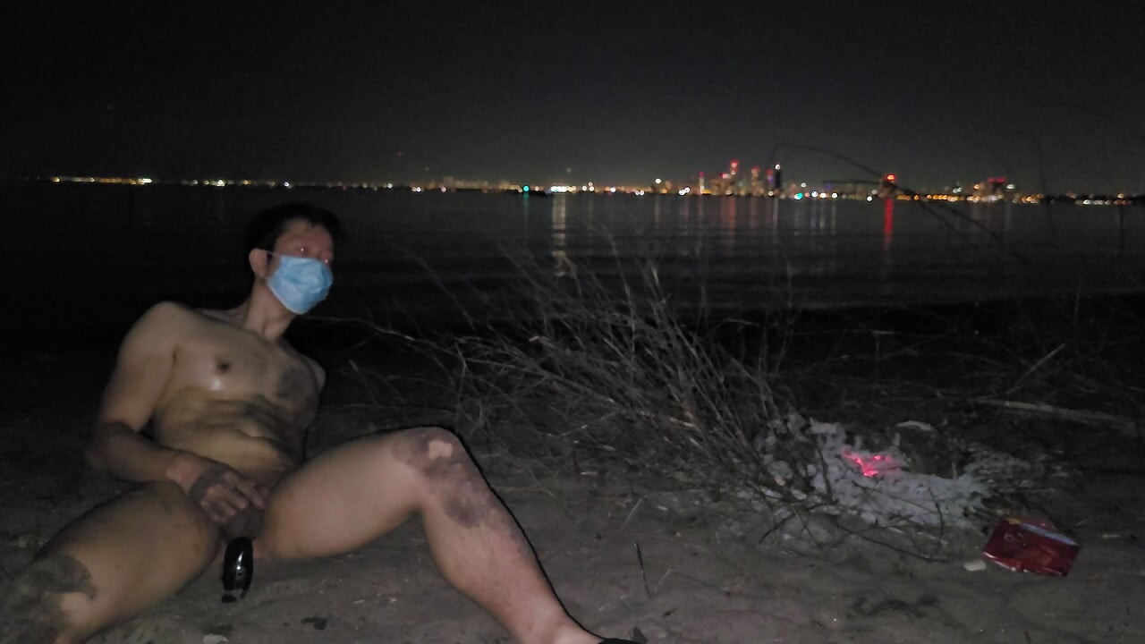 oiled masturbating and piss on the nude beach at night