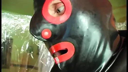 Dirty slave in fetish leather fucked by a sex toy