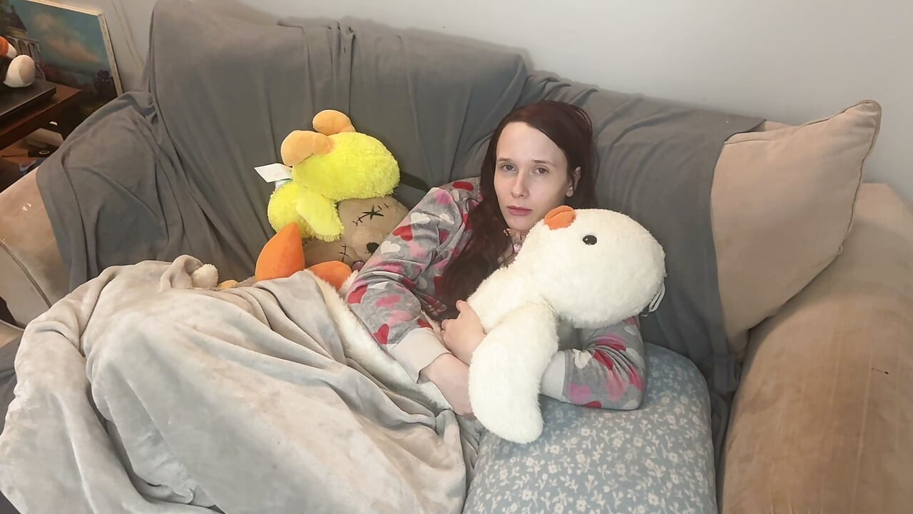 girl takes cares of mans feet after work. she takes off his boots and socks and smells them deeply