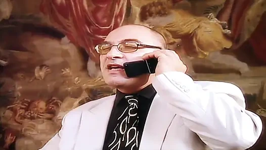 The secretary gives her boss a blowjob during a business call.