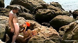 At the beach the brunette milf has anal sex that ends with a facial