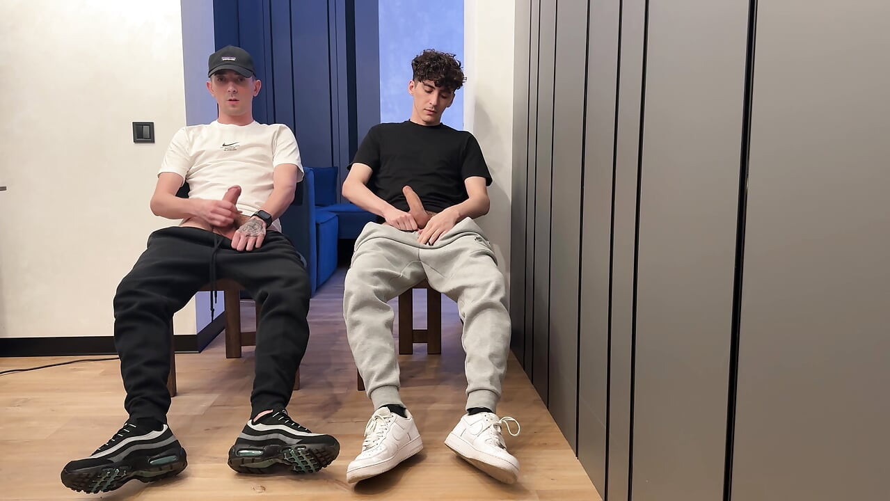 Two lads jerk off uncut dick and cum