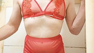 Boy wearing sexy red women's lingerie