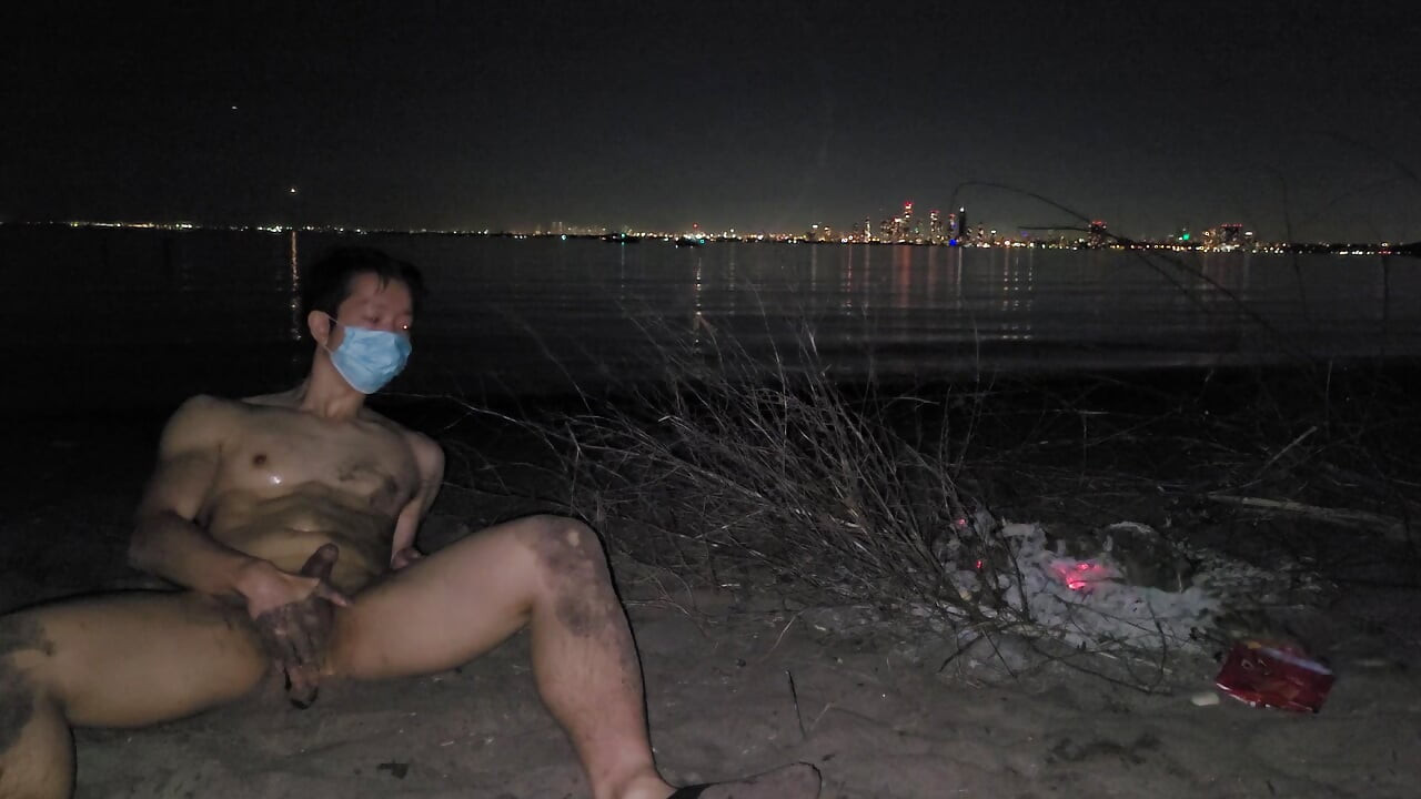 oiled masturbating and piss on the nude beach at night