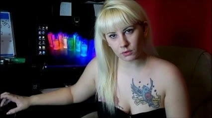 Tatooed blonde tapping fingers. JOI