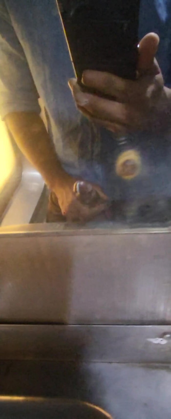 Key moment from "Desi guy jerking off in public train"