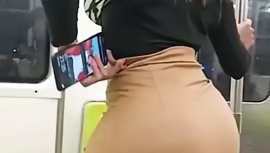Sensual shemale in the city subway showing her ass
