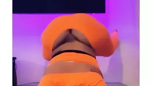 Ghetto Barbie twerking in orange jumpsuit and hoodie