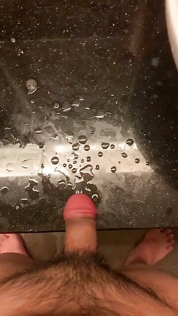 rubbing my big swollen cock head until i sprayed all over the table