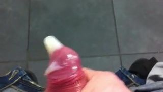 Cum filling a condom in a public bathroom