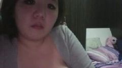 Asian girl on can is sexy nighty.