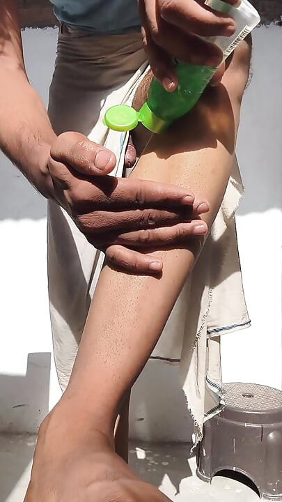 Young guy rubs his thick penis with oil