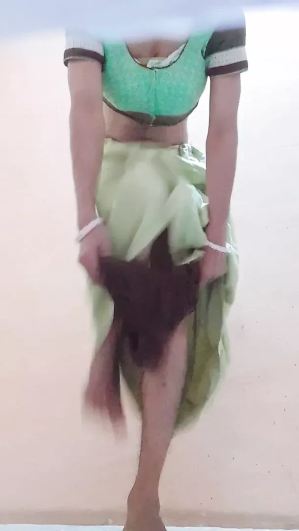 Crossdresser in blouse and peticoat with panty