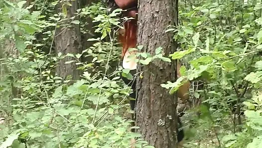 Blowjob in the Woods From the Redheads in a Leather Mask