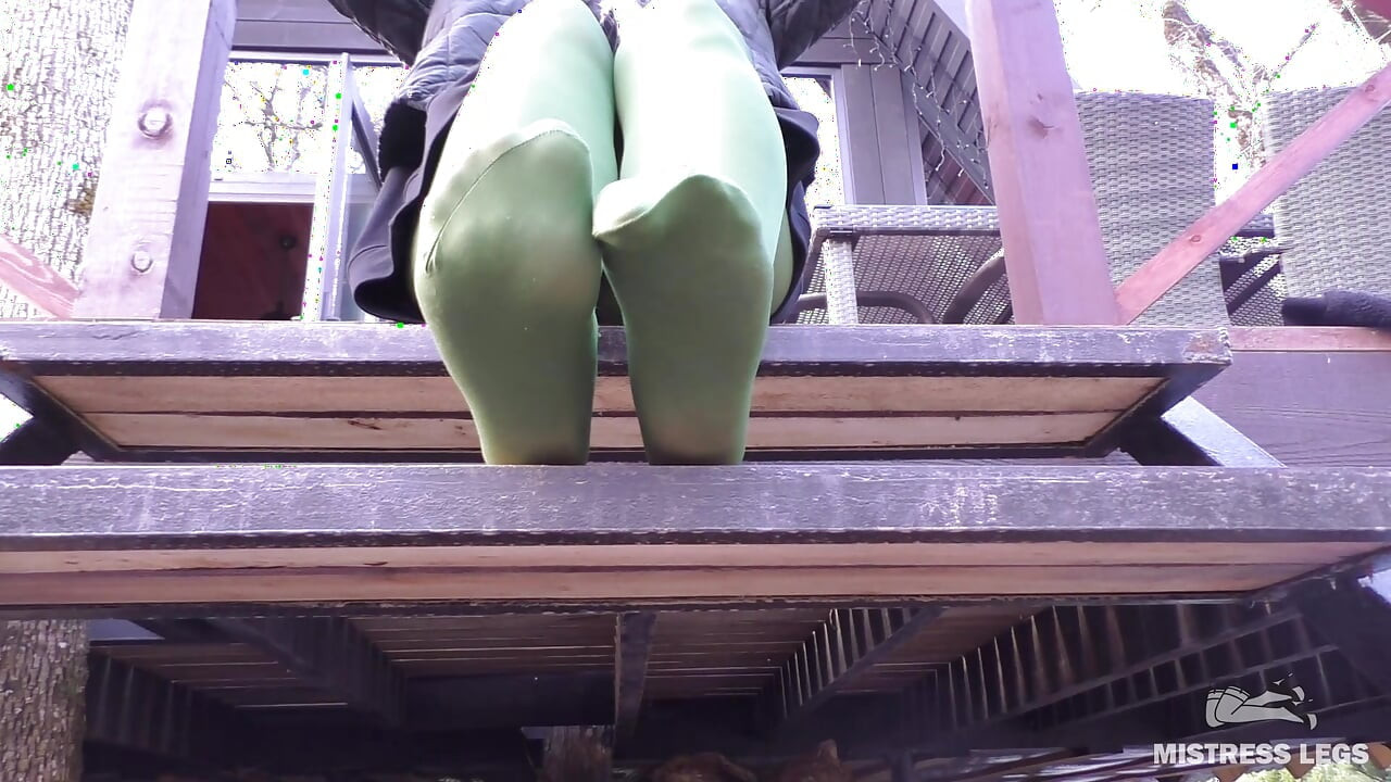 Goddess in Green Pantyhose Teases with Her Feet on the Porch