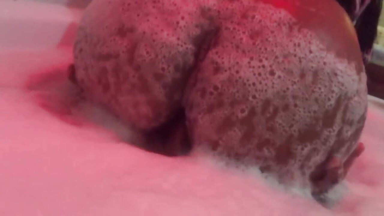 Eating brunette's big ass in the bathtub