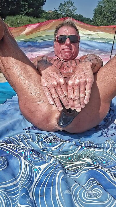 Early morning at the beach stretching of my asshole with my huge black dildo