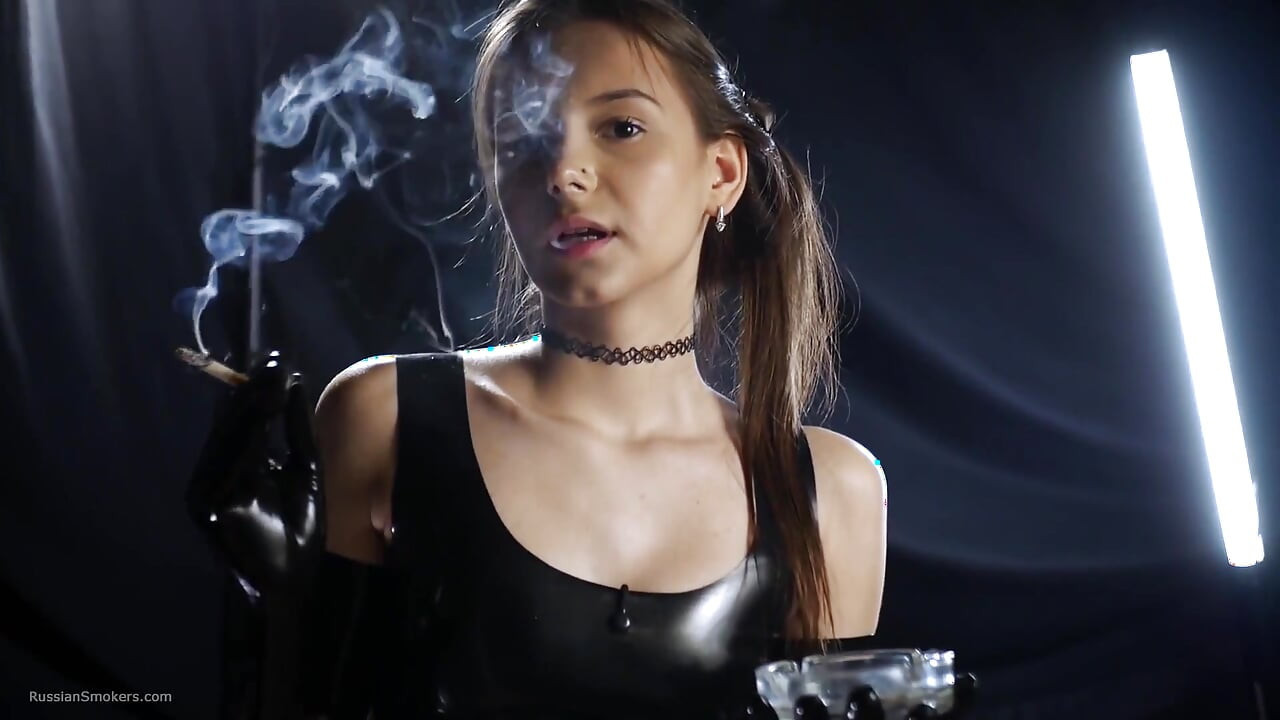 Brunette Smoking in Black Latex Outfit Slow Sensual Scene