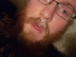 bearded boy cums all over his face