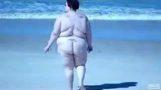 Fat Slut walking on beach