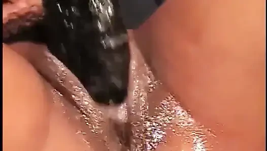 Two Giant Black Cocks Fill up The Pussy on This Hot Exotic Brunette.