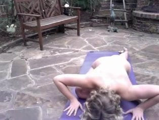 bysty girl doing naked yoga in the backyard