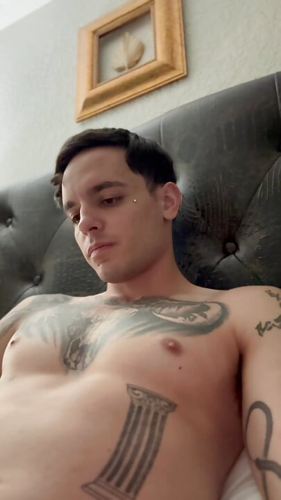 Adult starts to insert piercing into hole and pre