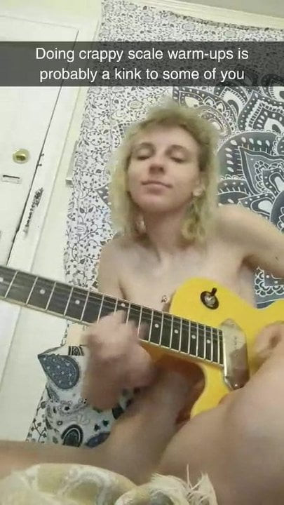 Happy naked babe jamming