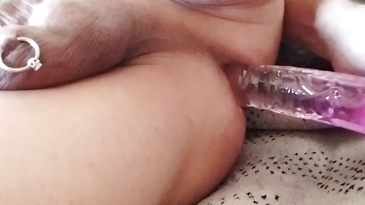 Playing with the dildo