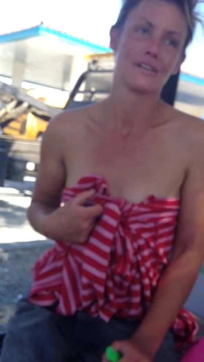 Young woman shows her tits