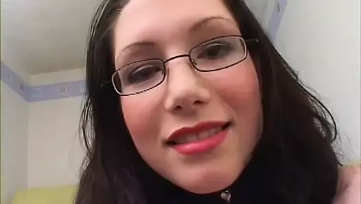 Dazzling brunette in glasses gets her cute face covered in cum after giving a blowjob