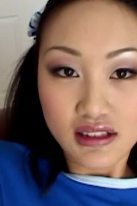 An Asian Female Engages in Self-stimulation While Anticipating Engaging in Intense Anal Intercourse in the Doggie Style Posture.