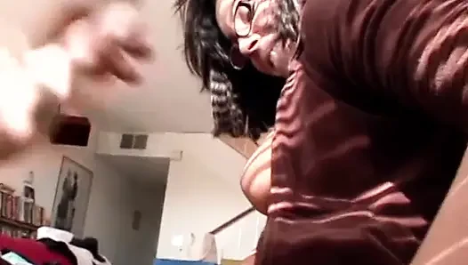 Sexy babe in glasses gives head to this dude with the long dong