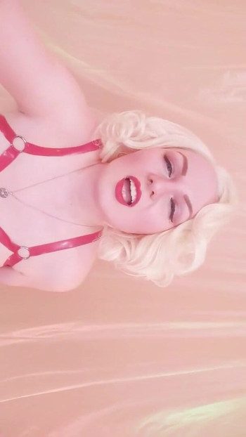 Captivating moment from "Strap-on POV video: topless Mistress in thigh high over knee boots with long gloves - Arya Grander"