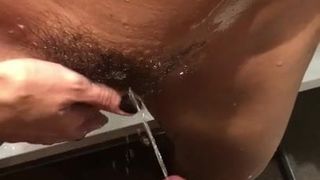 Pissing on hairy pussy