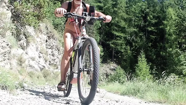 stretching the nipples naked on a byke ride