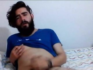 gay bearded young cub plays with his cock and nipple