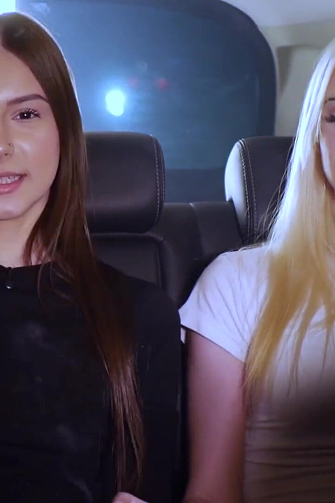 Two Women Smoking and Chatting in a Car at Night