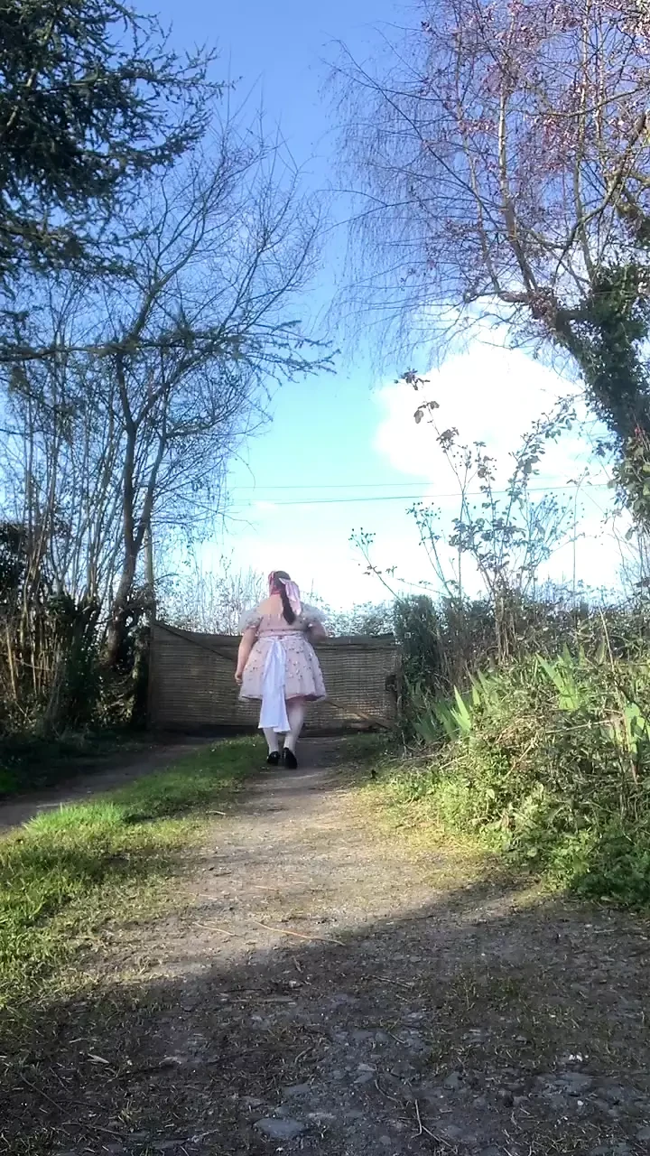 In a babydoll outfit to pee a second time in the diaper outside