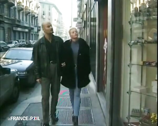 A Dirty Blonde Is Getting Fucked by Two Perverts in a Sex Shop