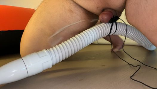 Small Penis With Vibrator Eggs Holding A Vacuum Hose