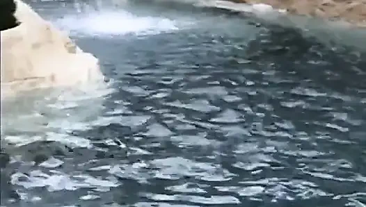 Ebony slut gets her pussy licked and fucked on the nature against the waterfall