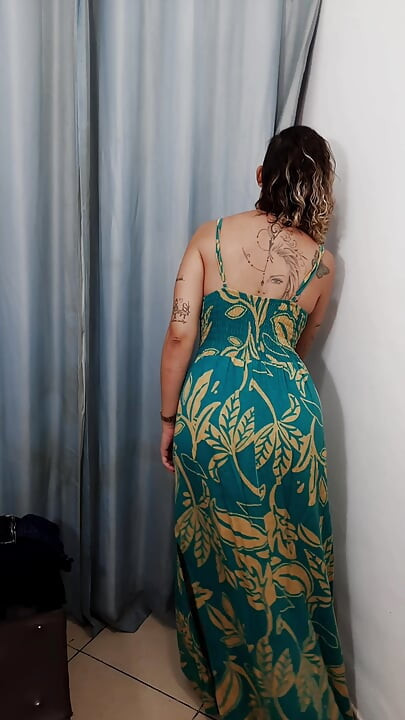 MILF has sex with a salesman in the dressing room.