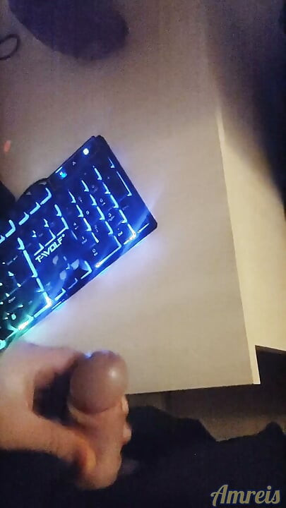 Gamer in the night. Cum on table.